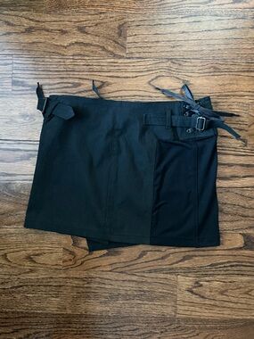 DIESEL Asymmetrical Black utility mini skirt with side buckles, zipper and ties.